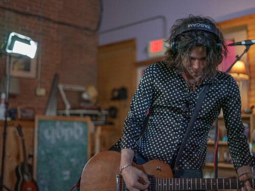 Izzy De Simone on guitar.