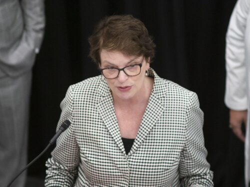 Brown University President Christina Paxson, seen here speaking at a June 2024 press conference, will take a 10% pay cut, as will some of the school’s other top executives, as the Ivy League campus tries to stave off financial pressures fomenting at the national level.