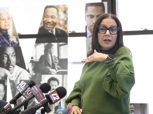 Angélica Infante-Green, Rhode Island Commissioner of Elementary and Secondary Education, speaks at a press event on Feb. 10, 2025, at Dr. Martin Luther King, Jr. Elementary School in Providence. Infante-Green, along with the state’s Attorney General, is advising schools to hold off on adopting federal directives regarding LGBTQ+ and DEI policies.