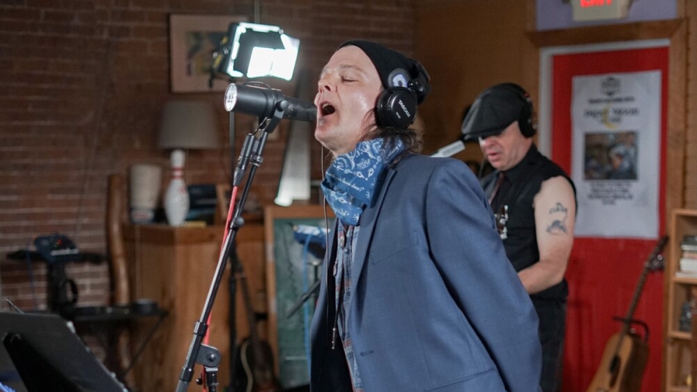 Paul "Pip" Everett belts out a song while Terry Linehan plays during a recent performance.