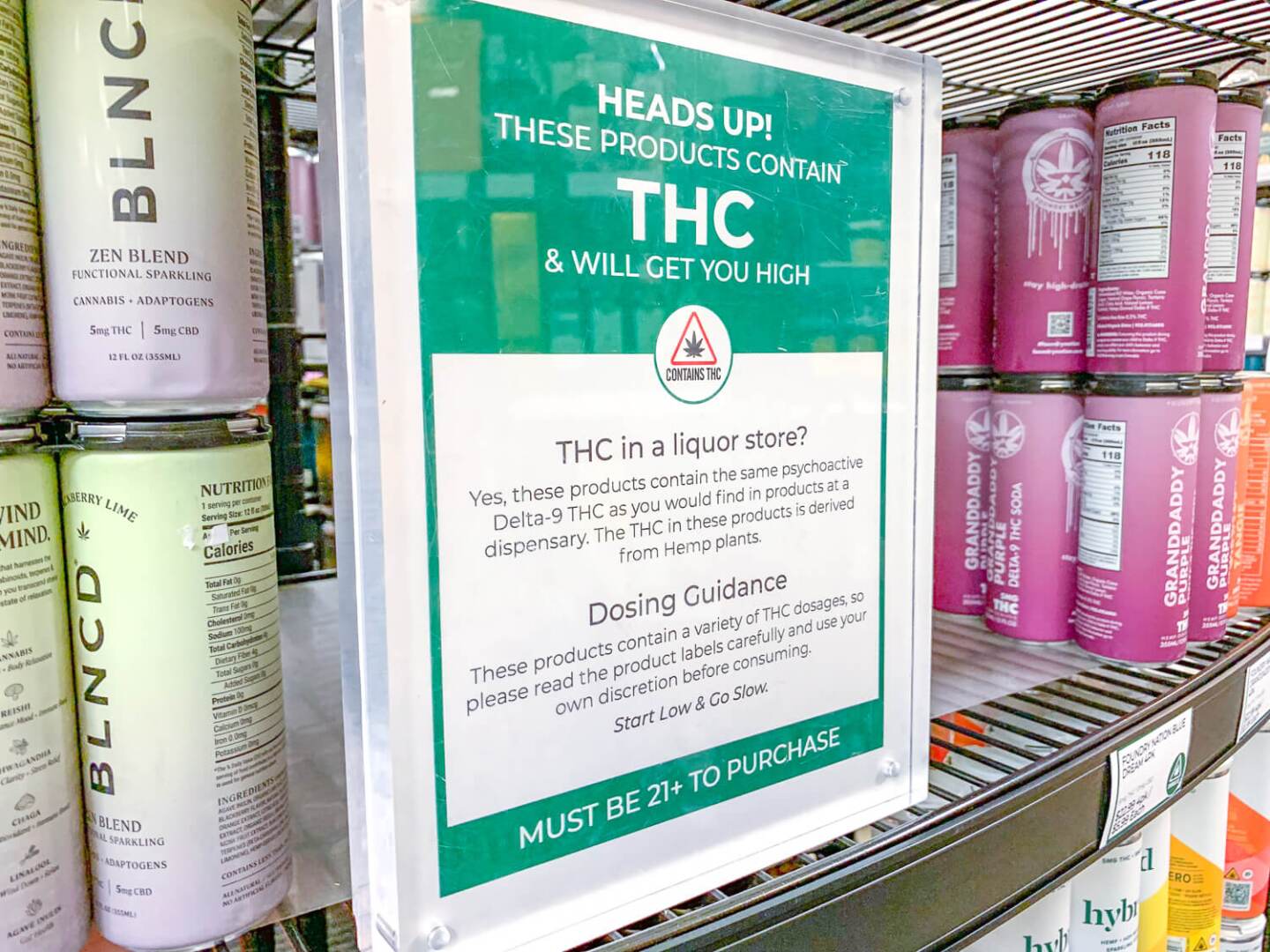 A sign explains the effect of delta-9 THC at Bottles Fine Wine on Providence’s East Side in October 2024. Next to the sign are boxes of hemp-derived beverages.