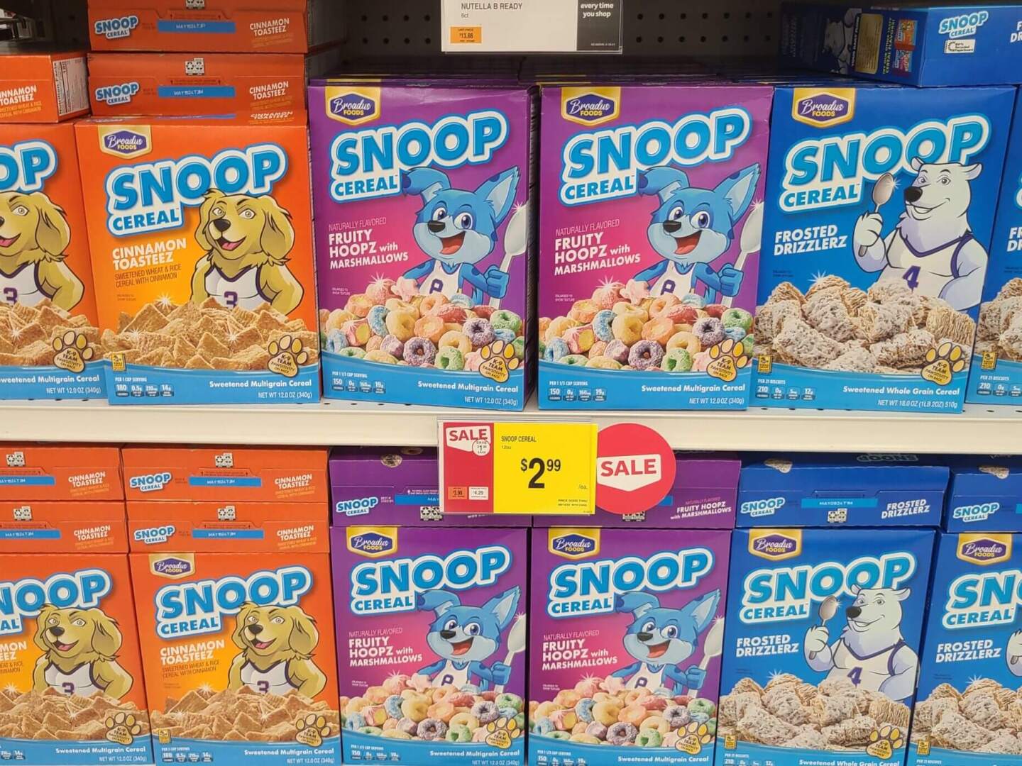 Cereal boxes are seen on a grocery store shelf.