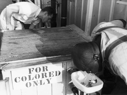 Segregated drinking fountain in use in the American South. Undated photograph.