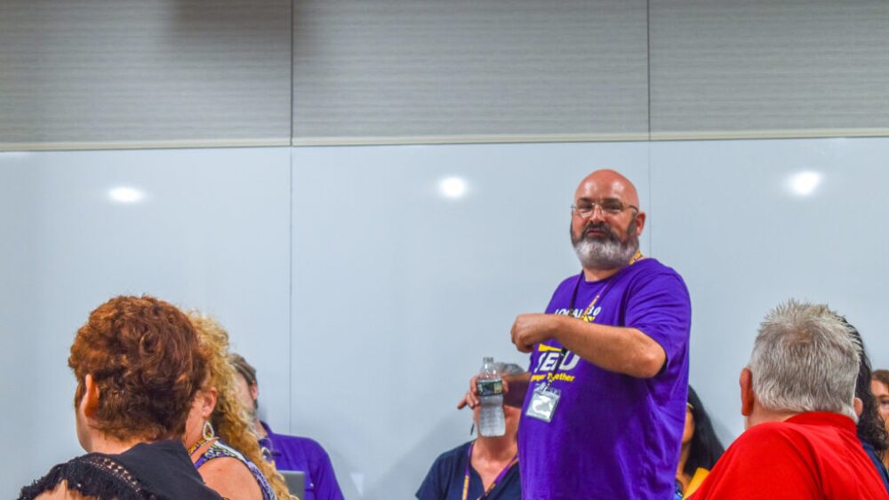 SEIU Local 518 President Matthew Gunnip speaks to the crowd of roughly two dozen people attending the State Properties Committee’s July 29 meeting. The union is opposed to seeing the panel renew a 10-year lease for the Rhode Island Department of Children, Youth and Families Providence headquarters.