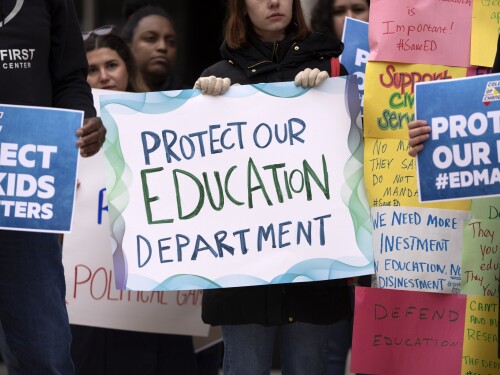 Protestors gather during a demonstration at the headquarters of the Department of Education, Friday, March 14, 2025, in Washington.