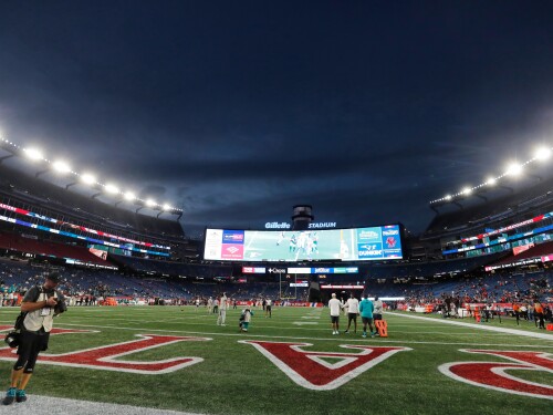 FILE — Lights illuminate Gillette Stadium before an NFL football game between the New England Patriots and the Miami Dolphins, Sept. 17, 2023, in Foxborough, Mass.