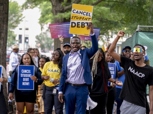 FILE - People demonstrate in Lafayette Park across from the White House in Washington, Friday, June 30, 2023, after a sharply divided Supreme Court has ruled that the Biden administration overstepped its authority in trying to cancel or reduce student loan debts for millions of Americans.